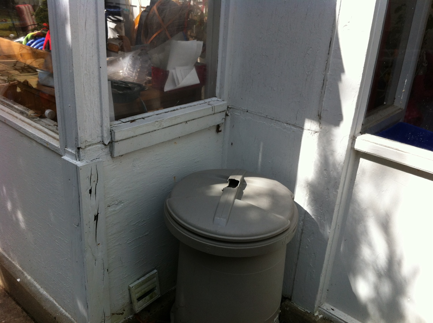 Historical photo of decay on the exterior mudroom wall before repair