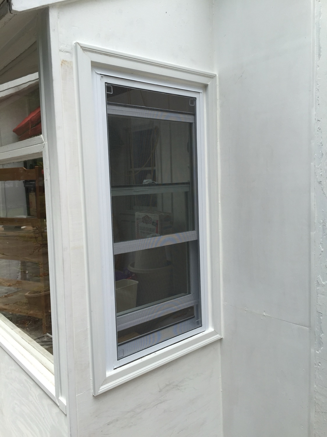 Historical photo of the rebuilt mudroom wall and newly fitted window